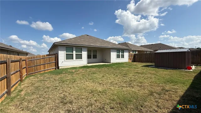 a front view of a house with yard