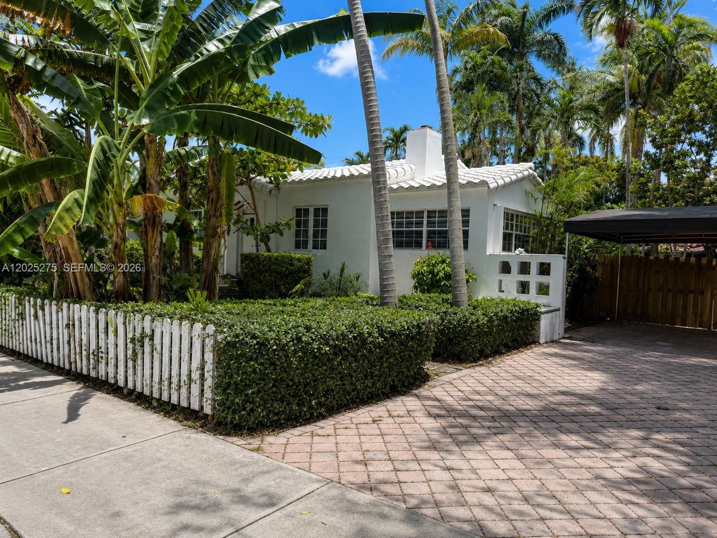 1329 Tyler Street Hollywood, FL 33019 - Photo 2 of 10 a view of a house with a yard