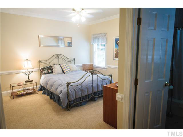 2212 Countrywood Road North Raleigh, NC 27615 - Photo 18 of 25 First floor guest suite with full bath and access to deck