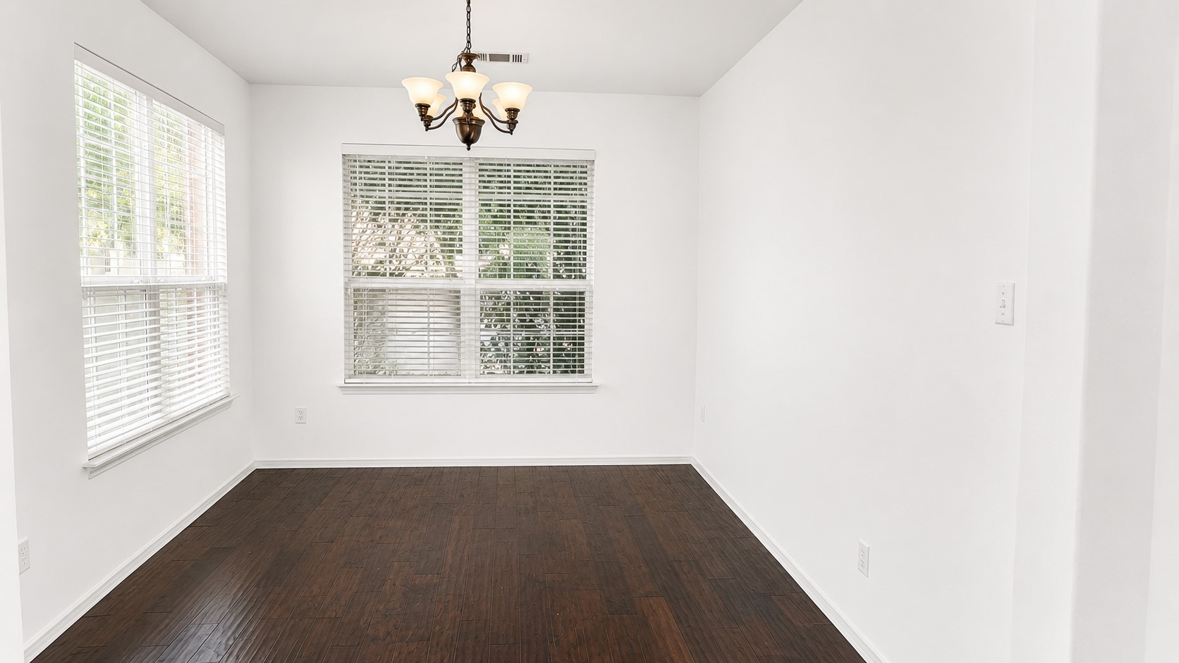 10528 Dunham Forest Road Austin, TX 78717 - Photo 5 of 12 Naturally illuminated dining area features rich wood flooring and classic window blinds.