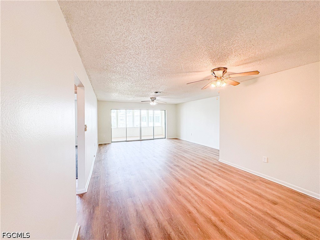 1830 Brantley Road, Unit I7 Fort Myers, FL 33907 - Photo 9 of 34 wooden floor in an empty room