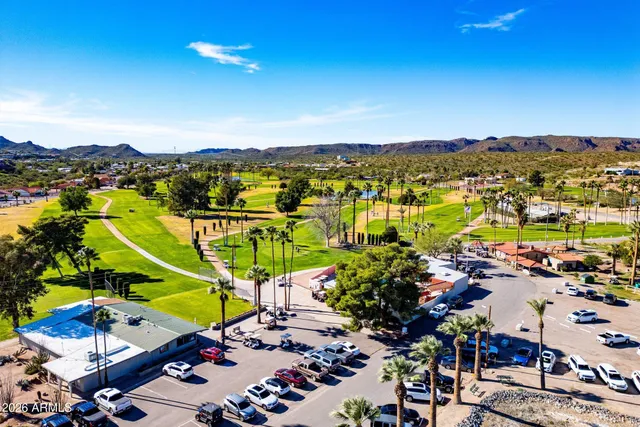 a view of a house with swimming pool and sitting area