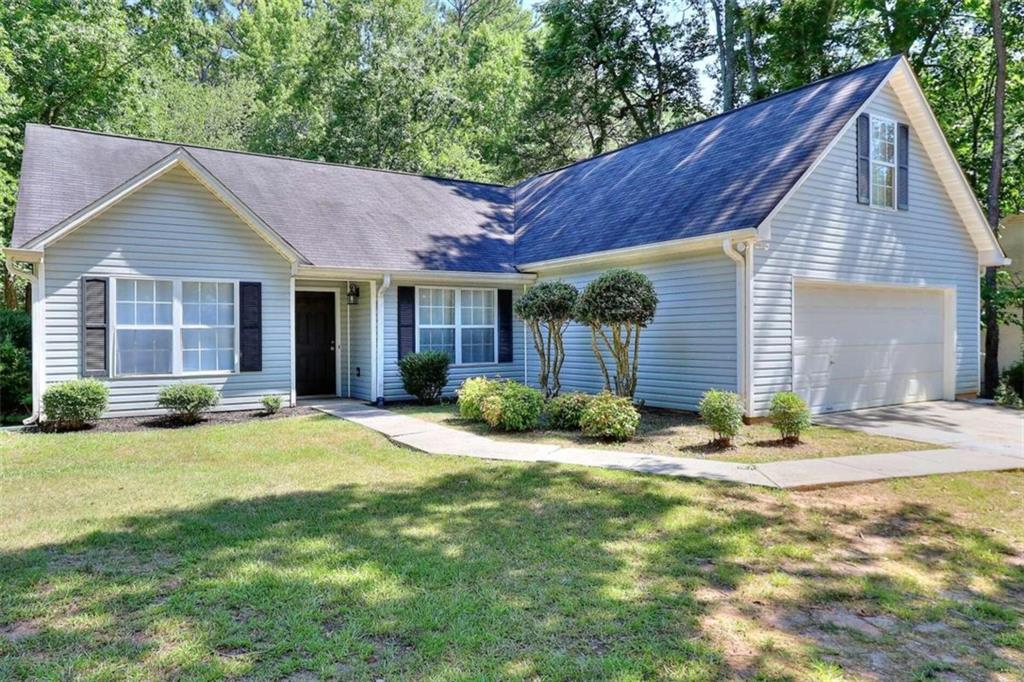 1002 Dutch Mill Road Monroe, GA 30655 - Photo 1 of 1 a view of a house with a yard and plants