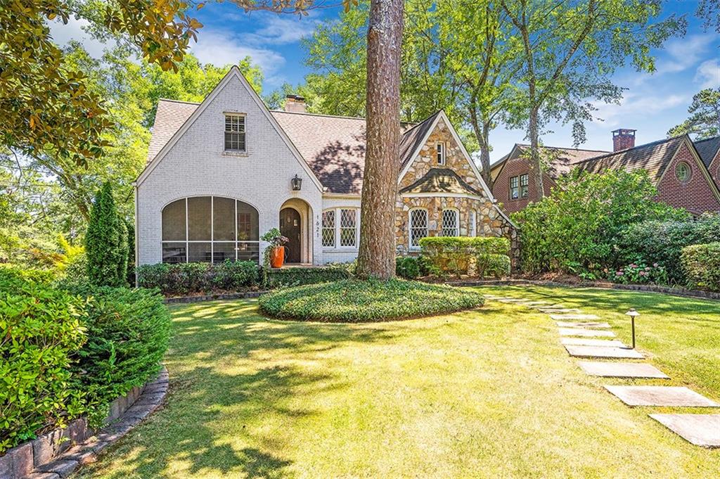 1621 Johnson Road Northeast Atlanta, GA 30306 - Photo 1 of 1 a view of house with garden and tall trees