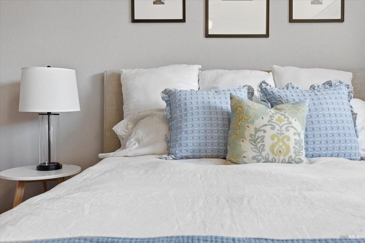 6900 Montecito Boulevard Santa Rosa, CA 95409 - Photo 15 of 25 a large bed sitting in a bedroom and lamp