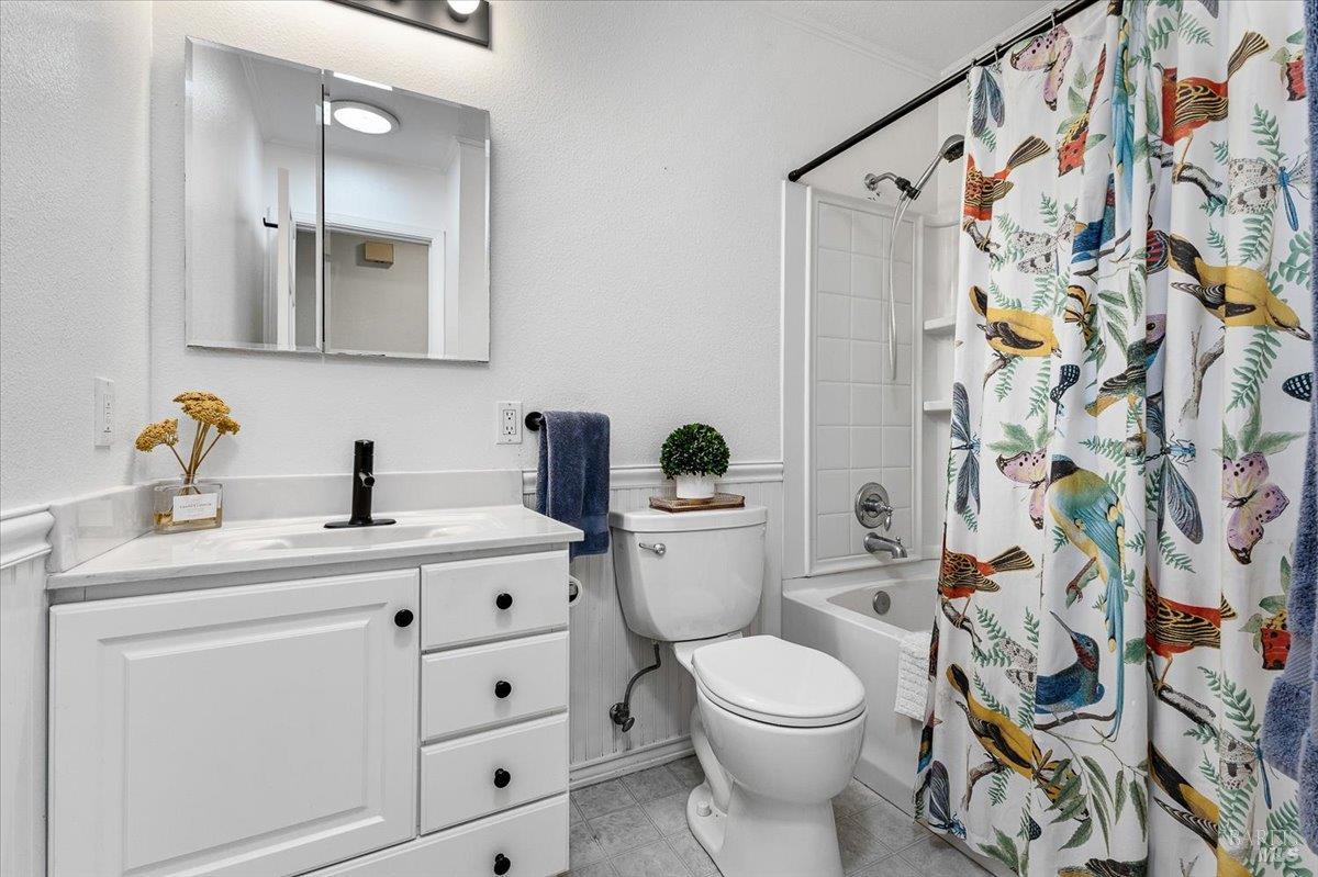 6900 Montecito Boulevard Santa Rosa, CA 95409 - Photo 19 of 25 a bathroom with a sink a toilet and a mirror