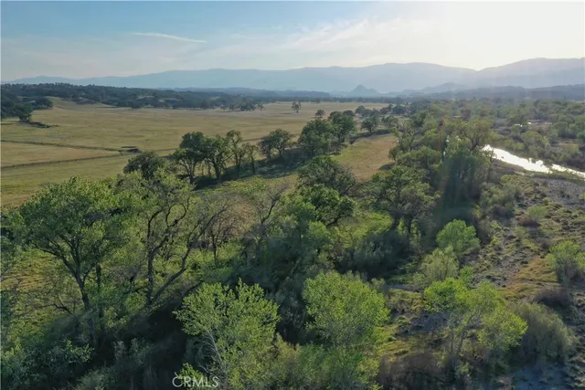 a view of a lake with lots of green space