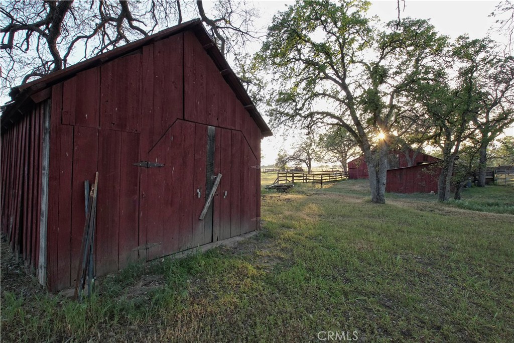15385 Weston Road Corning, CA 96021 - Photo 49 of 75 a view of backyard with barn and wooden fence