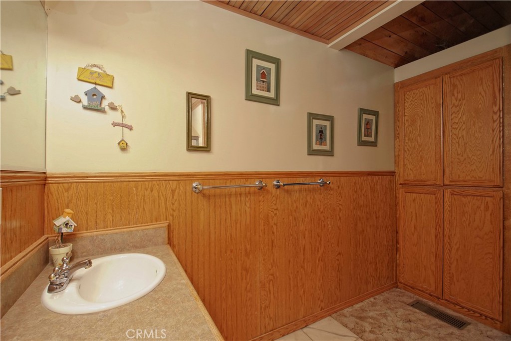 15385 Weston Road Corning, CA 96021 - Photo 70 of 75 a bathroom with a sink and a mirror