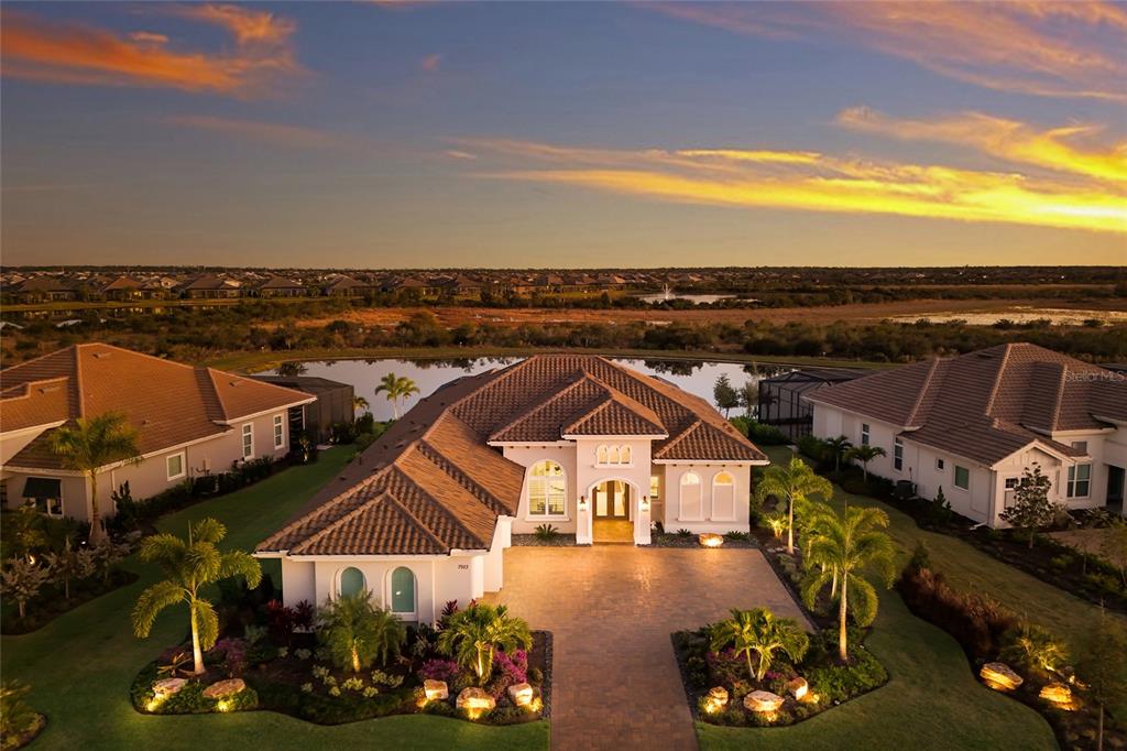 an aerial view of a house with a ocean view