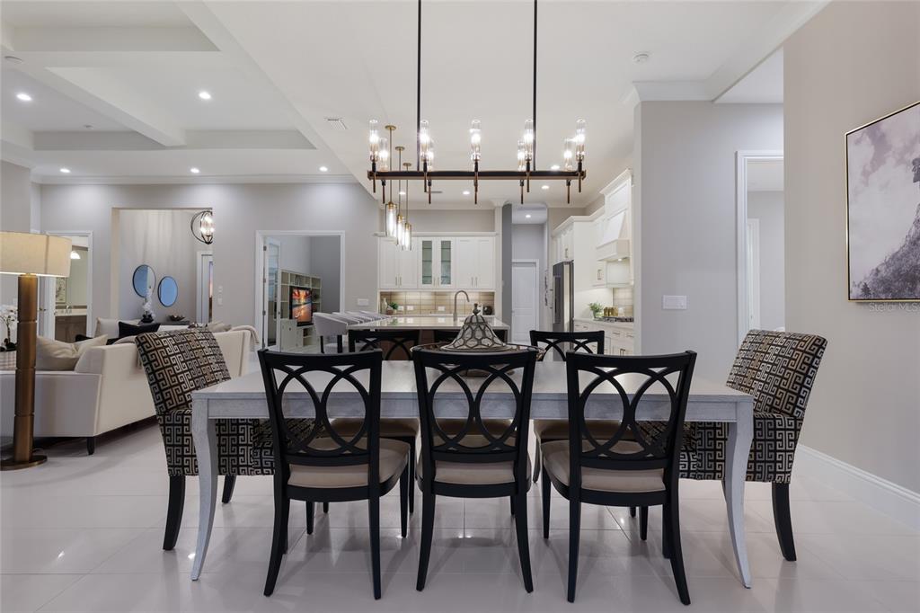 7923 Bowspirit Way Lakewood Ranch, FL 34202 - Photo 24 of 82 a view of a dining room with furniture and wooden floor