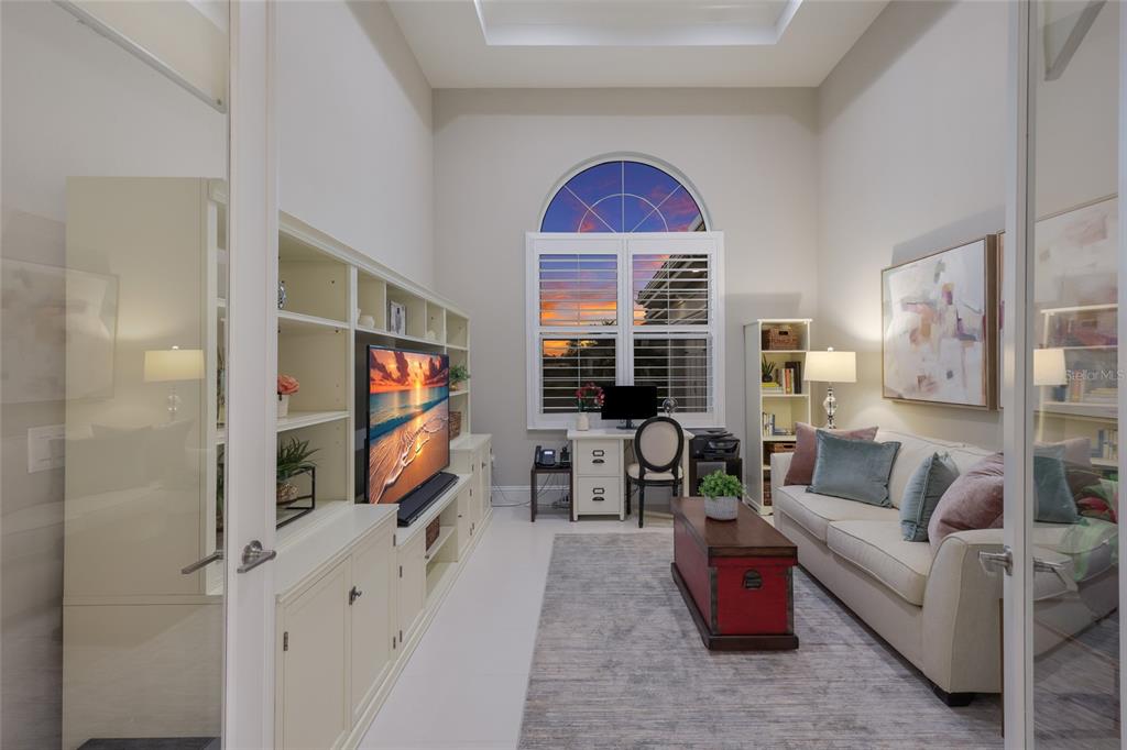 7923 Bowspirit Way Lakewood Ranch, FL 34202 - Photo 25 of 82 a living room with furniture and a flat screen tv