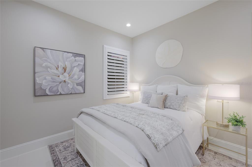 7923 Bowspirit Way Lakewood Ranch, FL 34202 - Photo 35 of 82 a bedroom with a bed and a painting on the wall