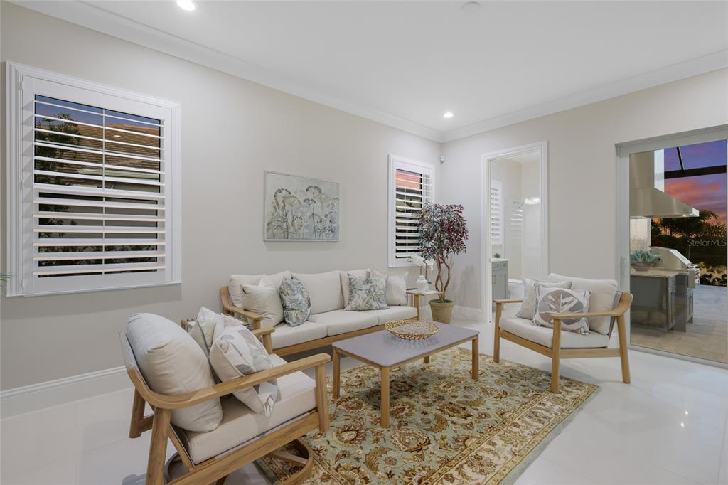 7923 Bowspirit Way Lakewood Ranch, FL 34202 - Photo 38 of 82 a living room with furniture and wooden floor