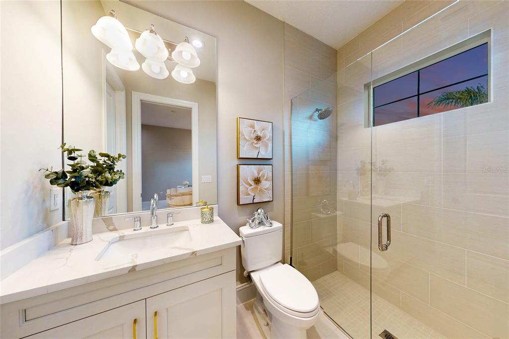 7923 Bowspirit Way Lakewood Ranch, FL 34202 - Photo 43 of 82 a bathroom with a sink a toilet and shower