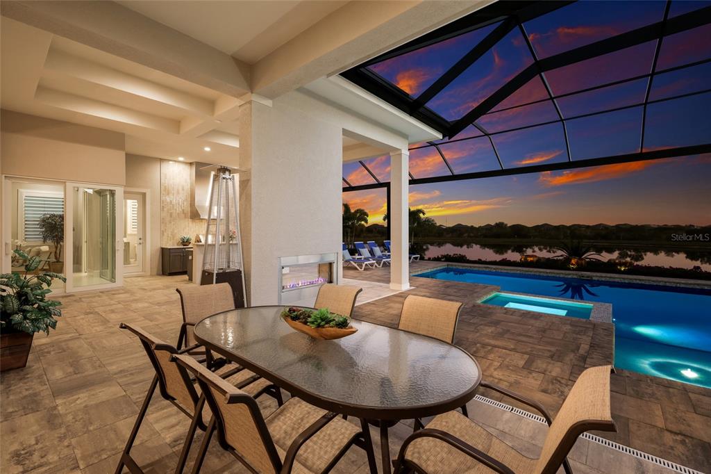 7923 Bowspirit Way Lakewood Ranch, FL 34202 - Photo 47 of 82 a dining room with furniture and a floor to ceiling window
