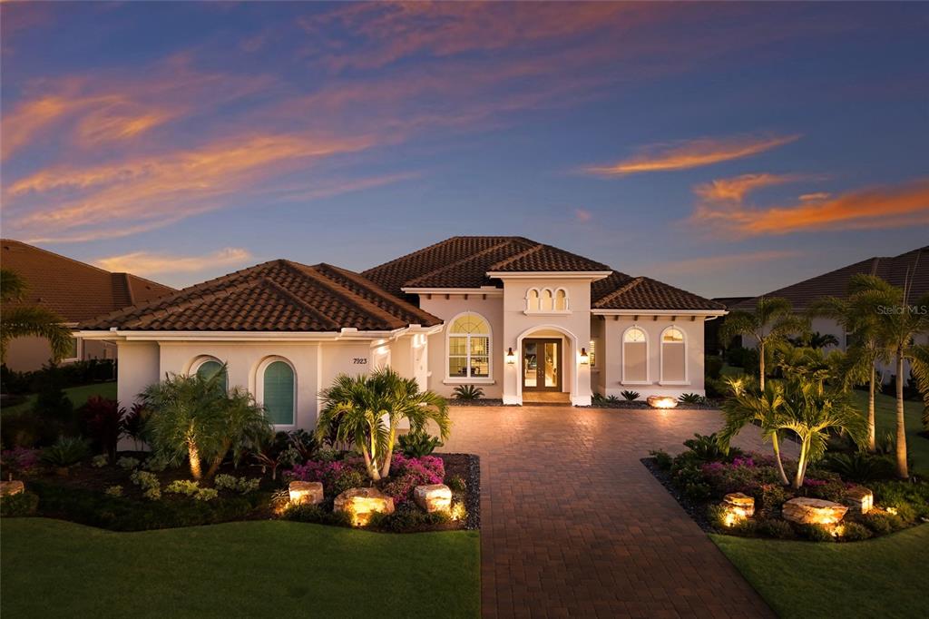 7923 Bowspirit Way Lakewood Ranch, FL 34202 - Photo 6 of 82 a front view of a house with a yard