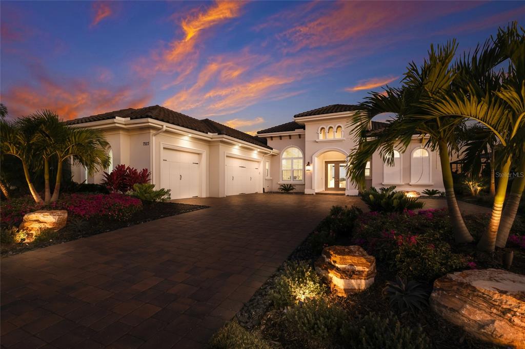 7923 Bowspirit Way Lakewood Ranch, FL 34202 - Photo 7 of 82 a front view of a house with a yard