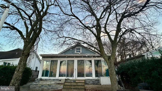 a view of a livingroom with a ceiling fan and window