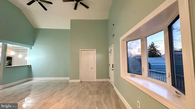 a view of an empty room with a window