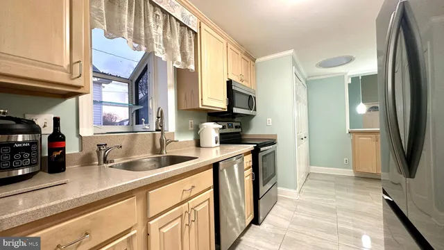 a view of a hallway view with large living space with furniture