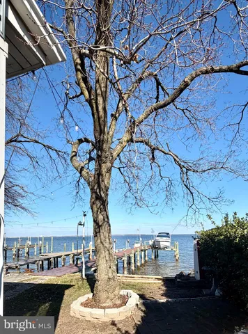 a living room with a couch and a fireplace