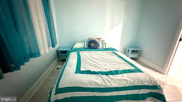 a bathroom with a sink a toilet a mirror and shower