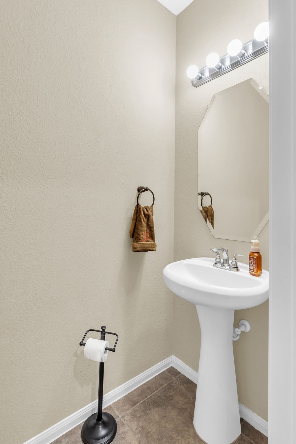16619 Dover Mills Drive Spring, TX 77379 - Photo 20 of 49 a bathroom with a sink and mirror