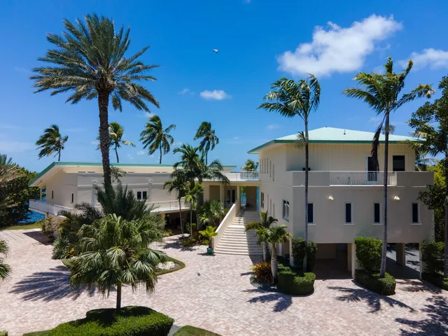 a view of a lake with a house in the background