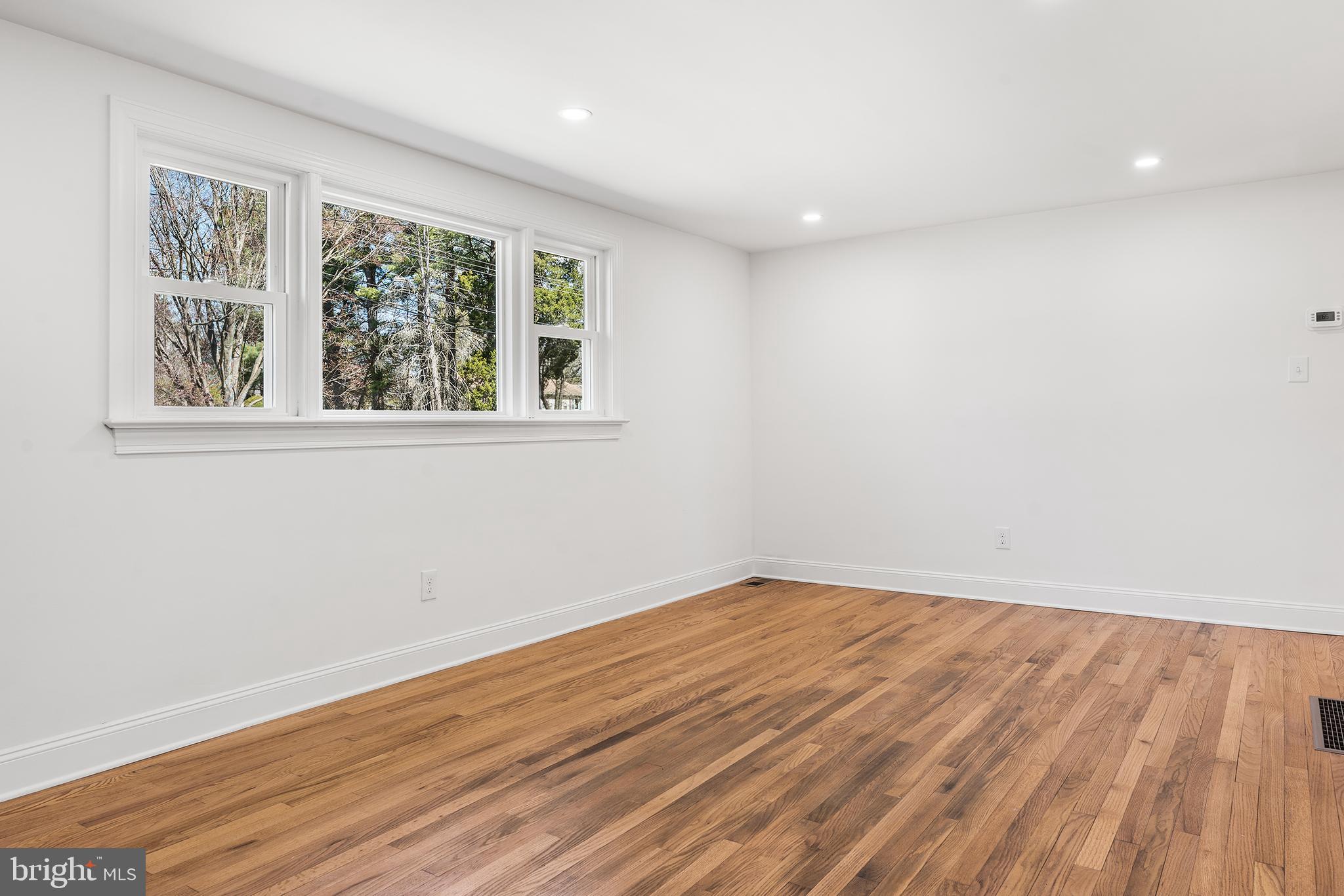 546 Heiser Road Collegeville, PA 19426 - Photo 11 of 30 a view of an empty room with wooden floor and a window