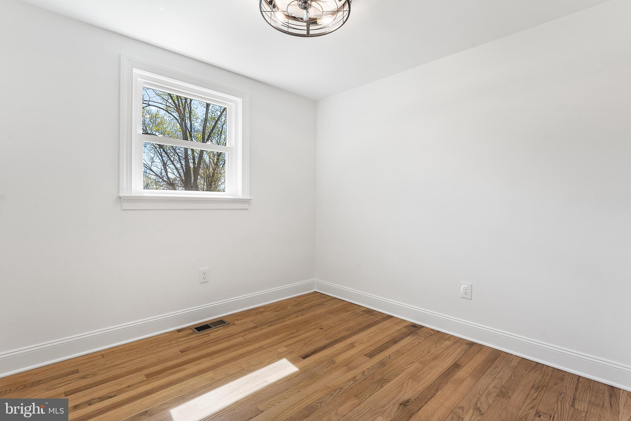 546 Heiser Road Collegeville, PA 19426 - Photo 14 of 30 an empty room with a window and wooden floor