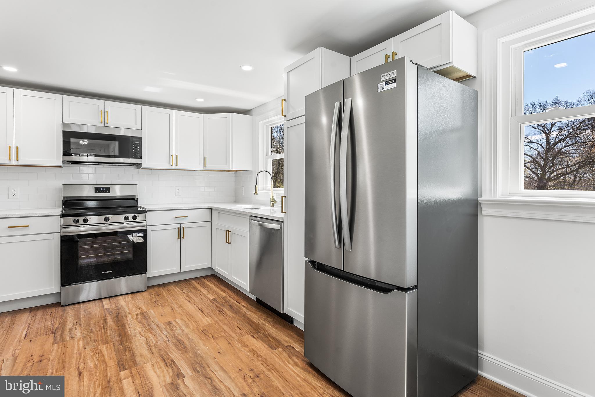 546 Heiser Road Collegeville, PA 19426 - Photo 7 of 30 a kitchen with stainless steel appliances a refrigerator sink and microwave