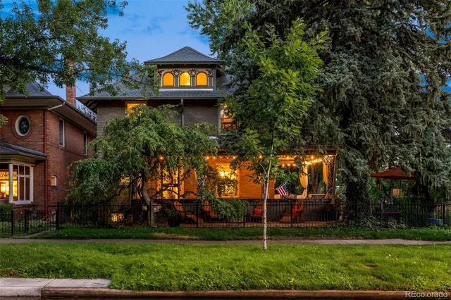 front view of a house with a tree