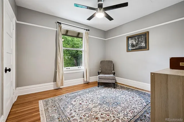 a living room with a couch and a rug