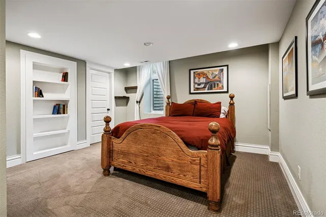 a bed room with a bed and a window