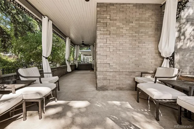 a backyard of a house with table and chairs
