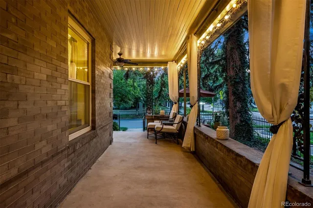 a backyard of a house with outdoor seating