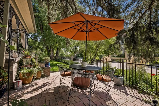 an outdoor space with furniture and umbrella