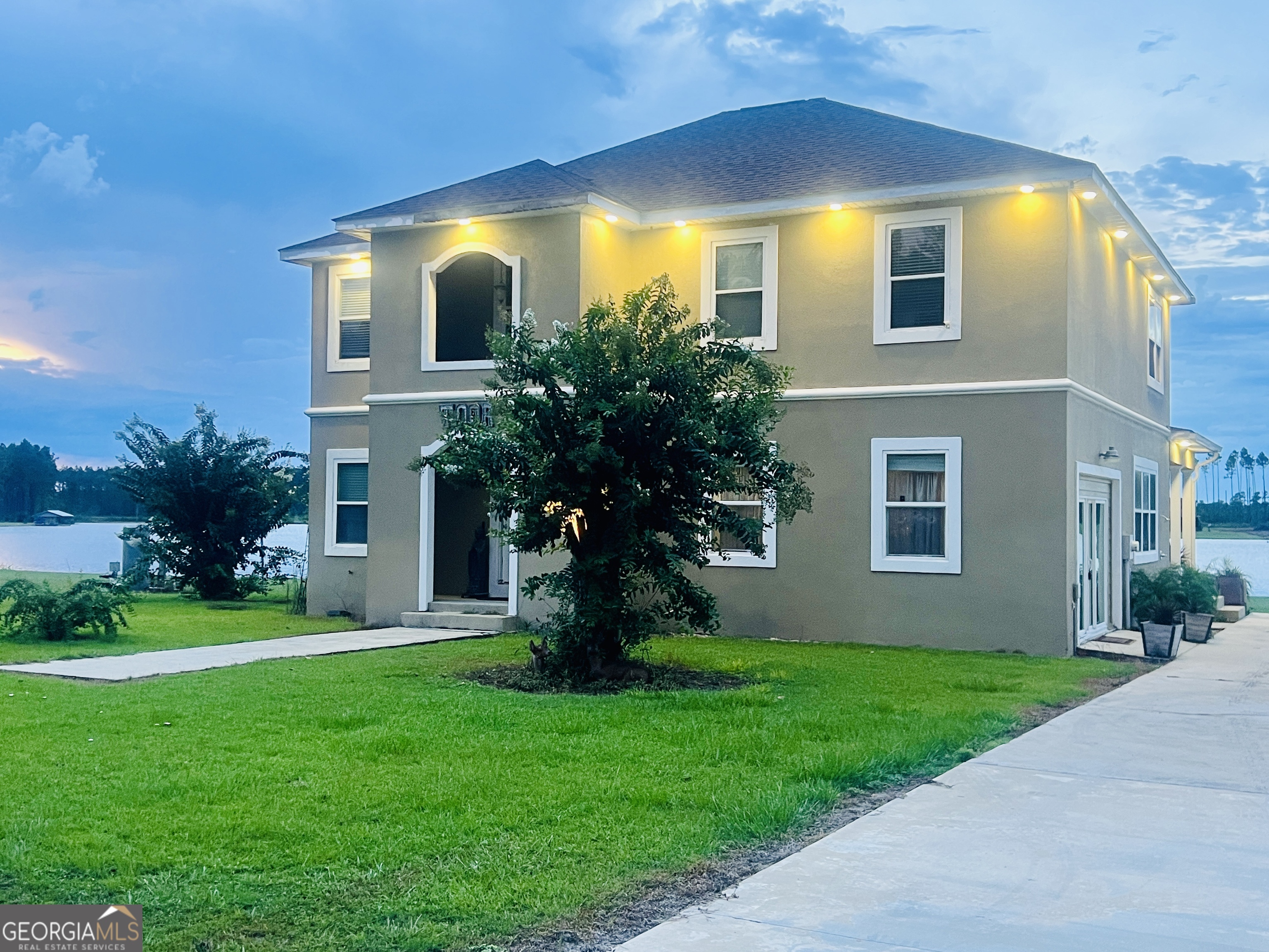 a view of a house with a yard