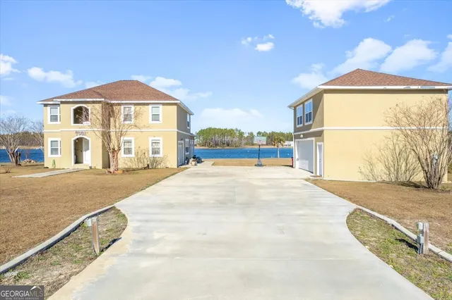 a front view of a house with a yard