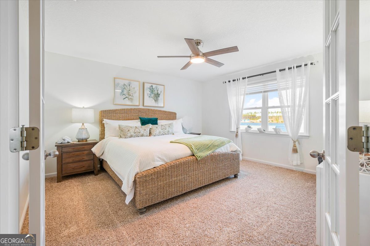 201 Miles Road Bristol, GA 31518 - Photo 31 of 69 a bedroom with a bed and window