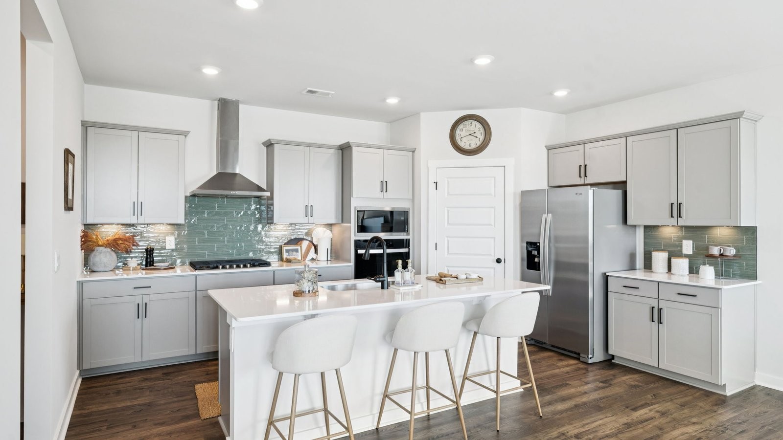 309 Harvest Point Boulevard Spring Hill, TN 37174 - Photo 19 of 46 a kitchen with stainless steel appliances kitchen island granite countertop a sink and cabinets