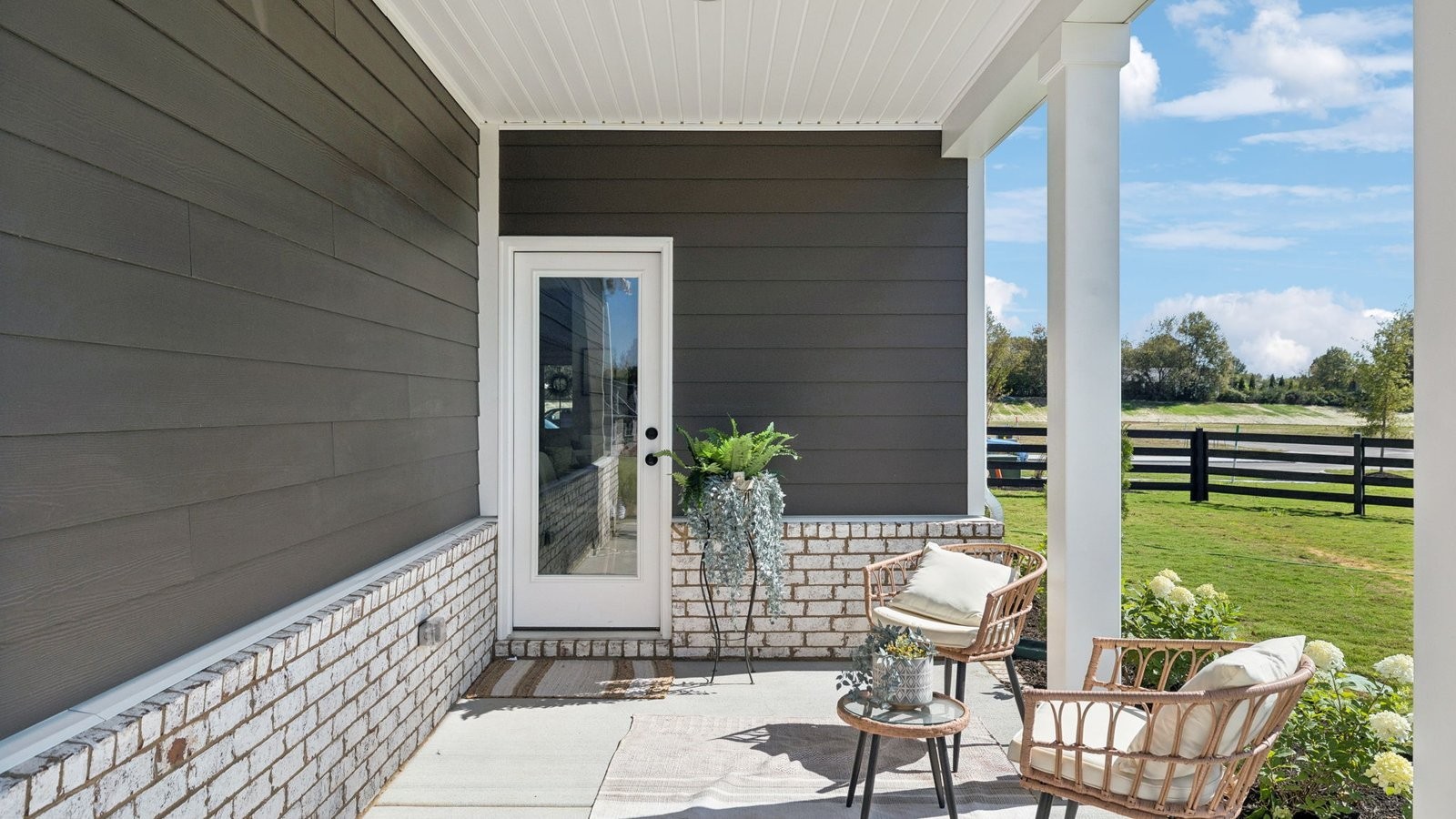 309 Harvest Point Boulevard Spring Hill, TN 37174 - Photo 41 of 46 a view of balcony with two chairs and potted plants