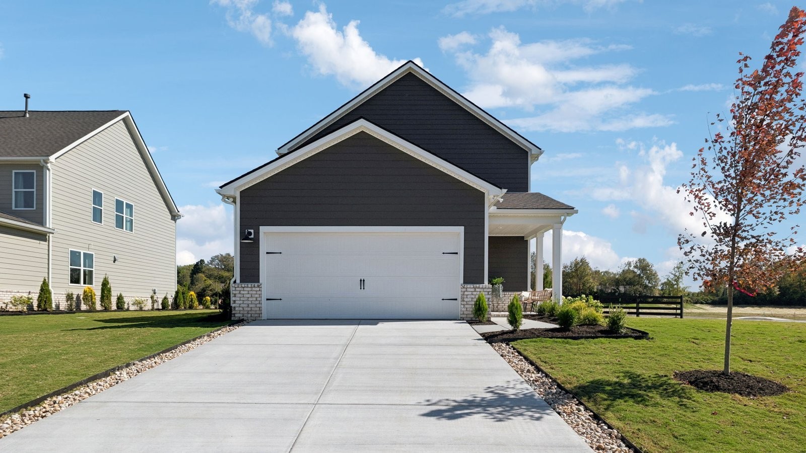 309 Harvest Point Boulevard Spring Hill, TN 37174 - Photo 45 of 46 a front view of a house with a yard
