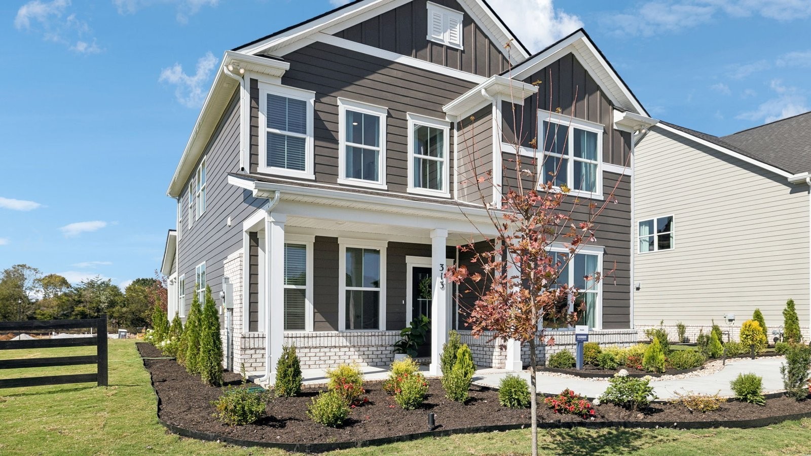 309 Harvest Point Boulevard Spring Hill, TN 37174 - Photo 6 of 46 a front view of a house with a yard