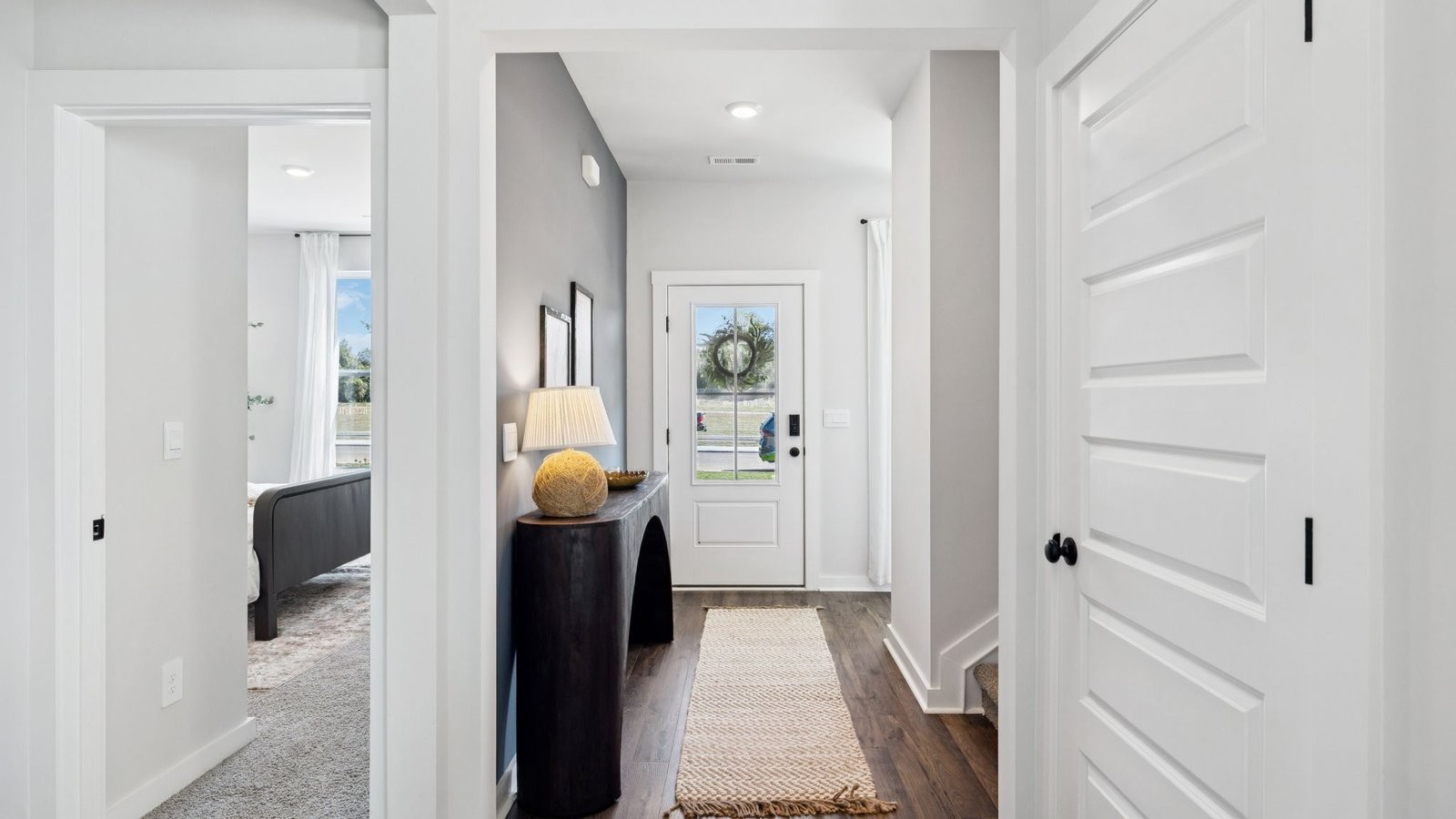 309 Harvest Point Boulevard Spring Hill, TN 37174 - Photo 10 of 46 a view of a hallway with living room and furniture