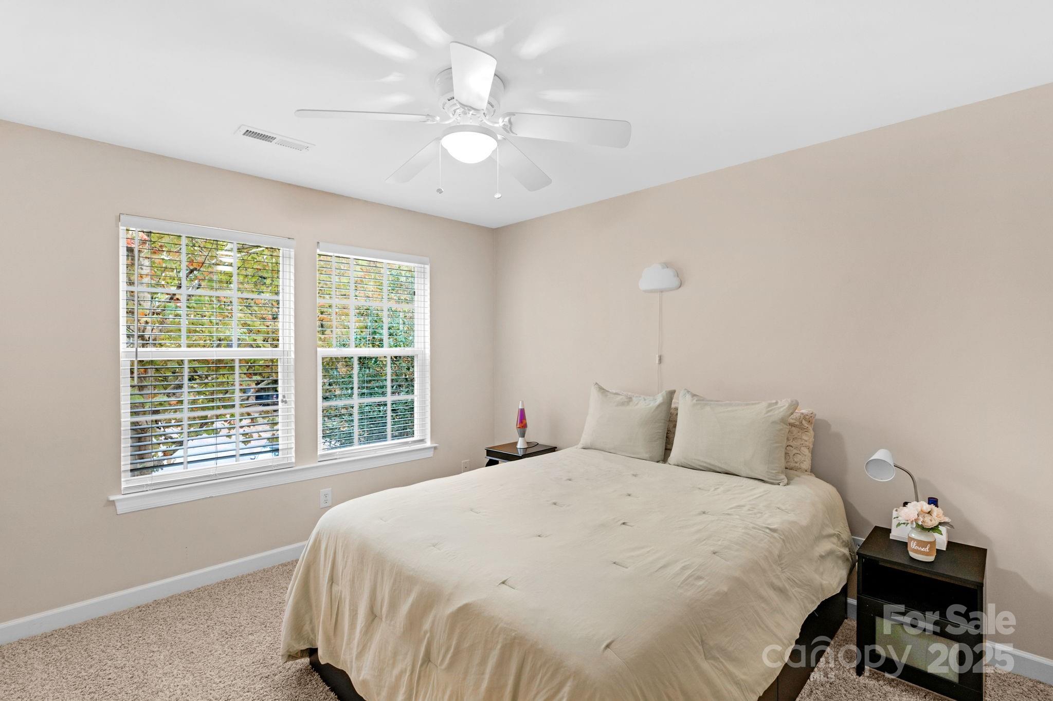 2805 Cross Tie Lane Matthews, NC 28105 - Photo 26 of 42 a bedroom with a bed and a window