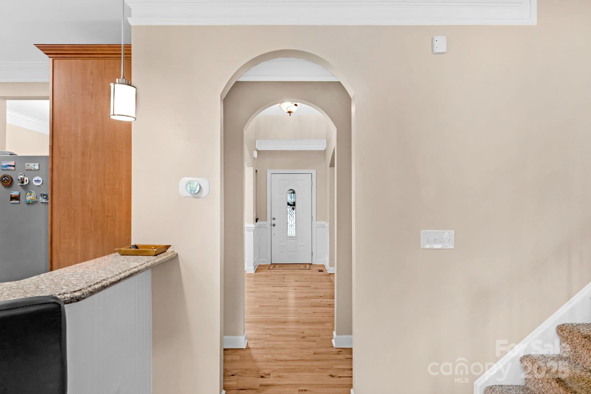 2805 Cross Tie Lane Matthews, NC 28105 - Photo 6 of 42 a view of a hallway with wooden floor and a bathroom