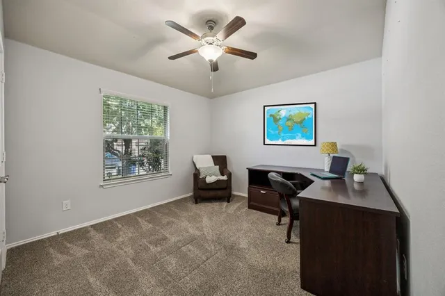 a workspace with furniture and window