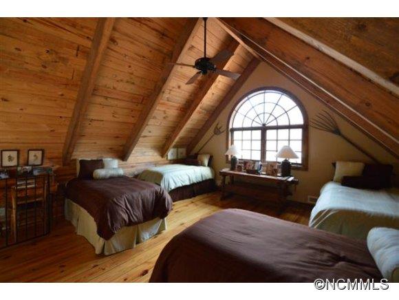 296 Broad Oaks Lane Rutherfordton, NC 28139 - Photo 16 of 19 a bedroom with a bed and wooden floor